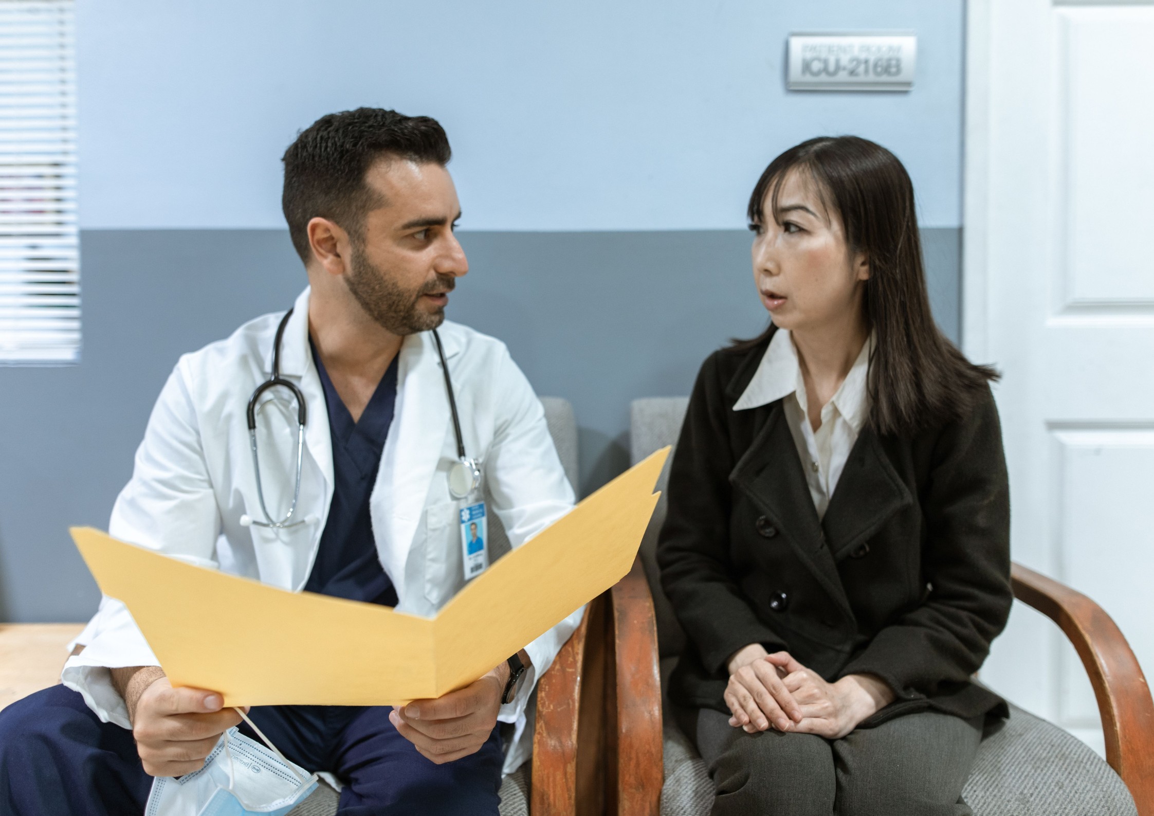 Doctor discussing a workplace injury with a patient